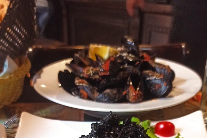3 Hour Kotor Food Tour - Rick Steves' Recommended - Trg Sv. Tryfuna square: sauces, bread, olives, olive oil, then buzara mussels