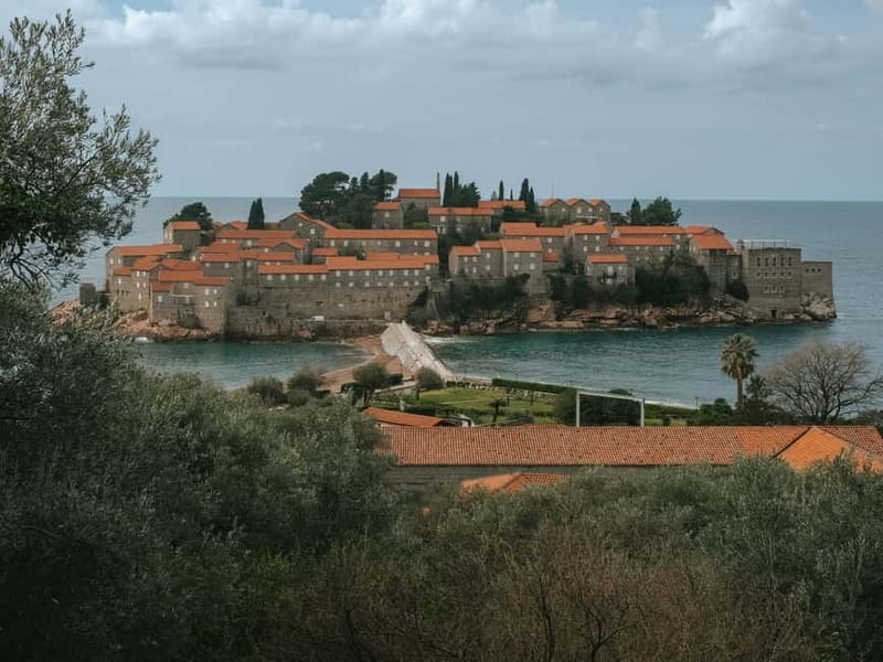From Tirana: Group Day Trip to Budva & Kotor in Montenegro - Budva marina walk and Fortress views, the best kind of contrast