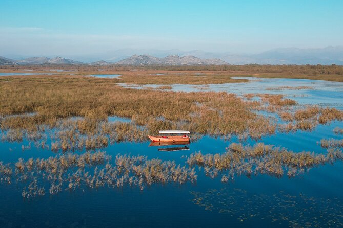 Private Skadar Lake National Park Tour with Wooden Boat and Wine - Morača River stop: an International Birding Area heading toward islands