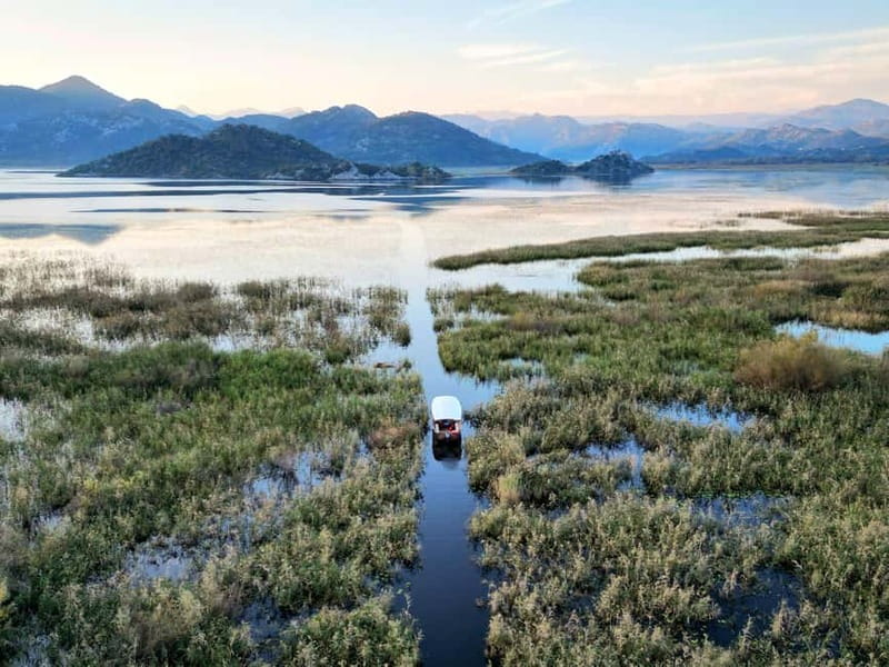 Skadar Lake: Guided Sunset Boat Tour with Wooden Boat & Wine - Key highlights you will actually feel